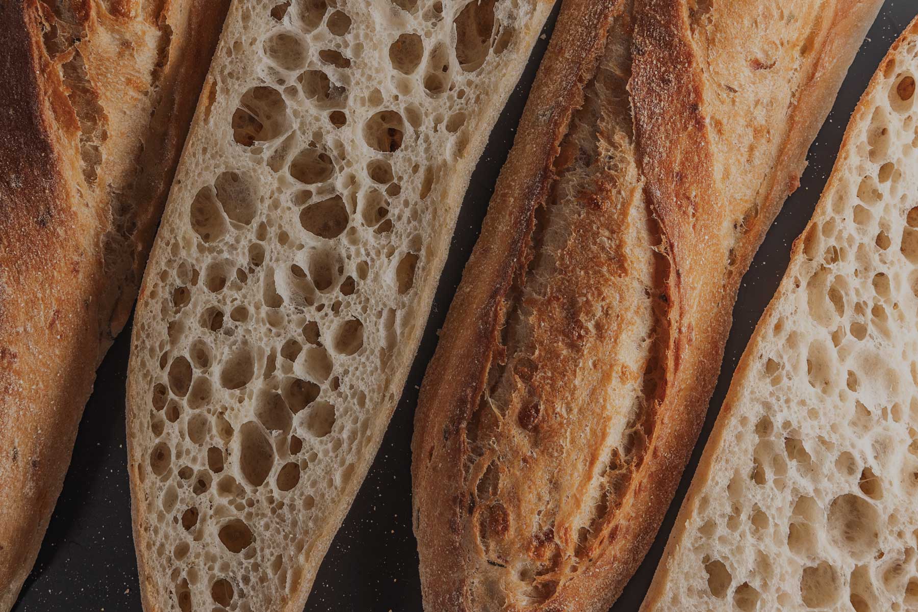 Assorted artisan bread selection for wholesale bakery customers in Tempe, AZ