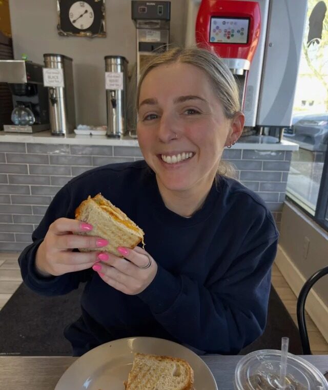 Customer enjoying a sandwich made with wholesale artisan bread in Tempe, AZ