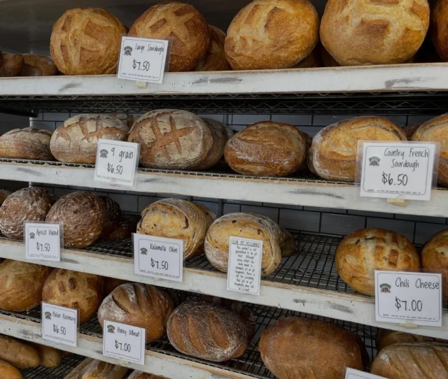 Fresh artisan bread display rack at Arizona Bread Company bakery in Scottsdale, AZ